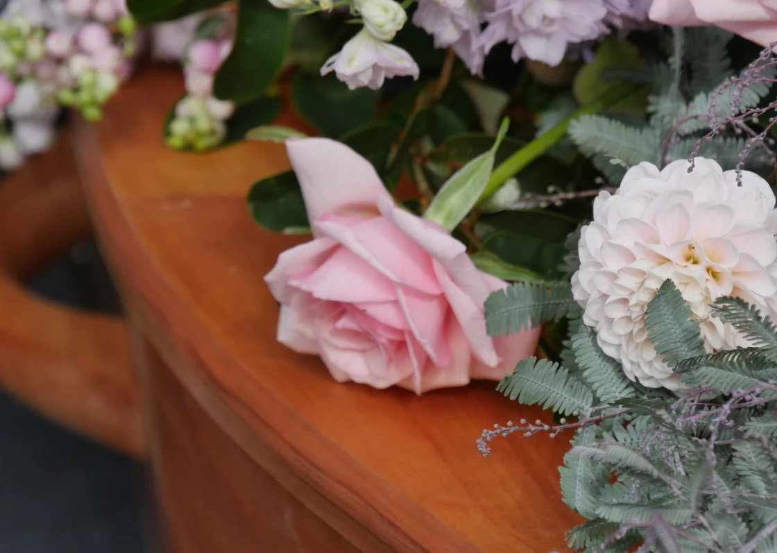 Close-up of roses and greenery arrangement